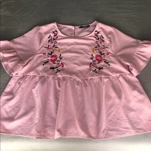 Light pink blouse with embroidered details